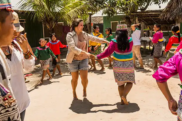 tourist dancing with jungle spots at san juan festival